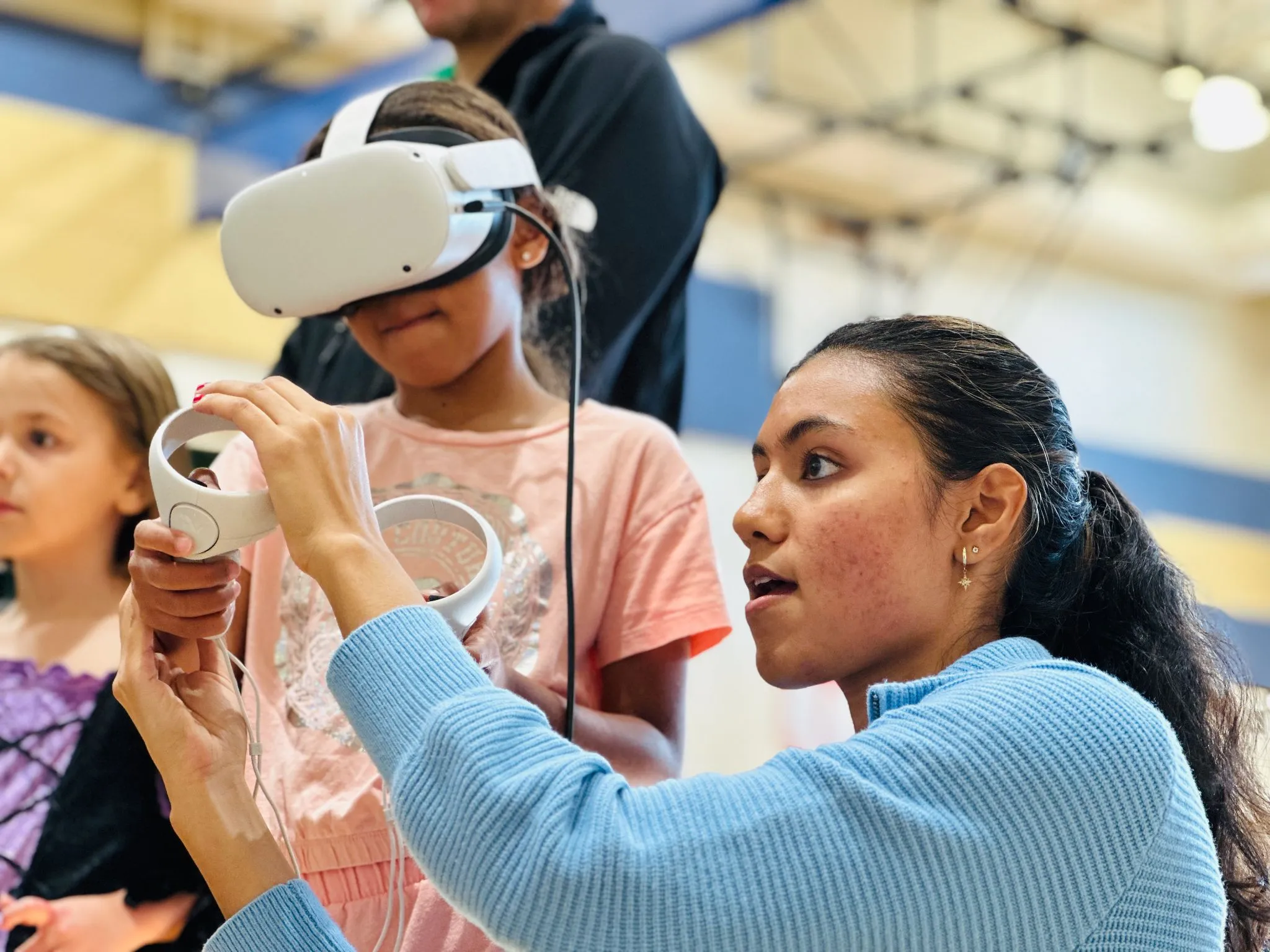 Ashmita guiding a small girl through her Faraday Lightning Safety module.