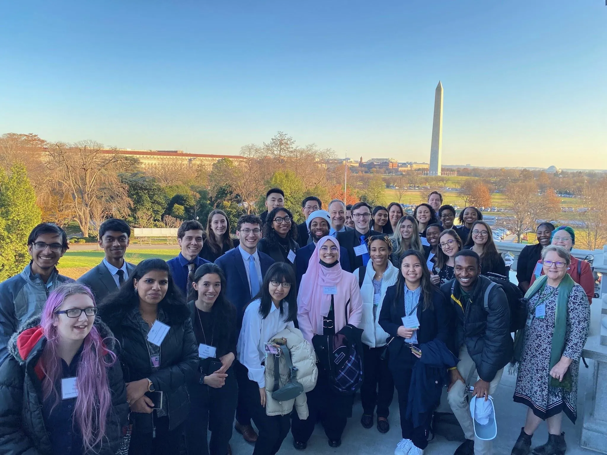 All the round table participants in an outdoor group photo at the White House.